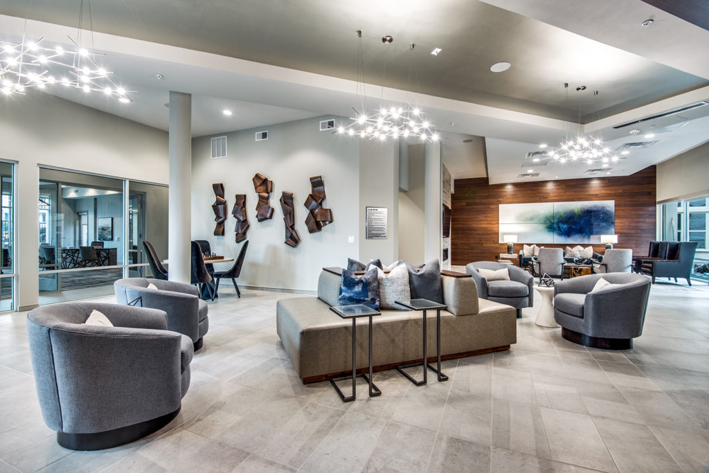 Community lobby with comfortable armchairs and modern architecture
